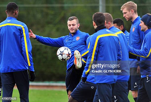 Arsenal's English midfielder Jack Wilshere controls the ball during a training session at Arsenal's training ground at London Colney, north of London...