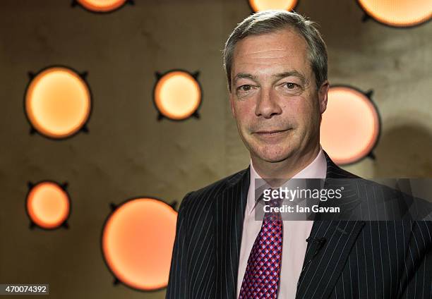Leader Nigel Farage poses for a photograph after talking with Angie Greaves on Bauer City Network at Bauer Radio on April 17, 2015 in London, England.
