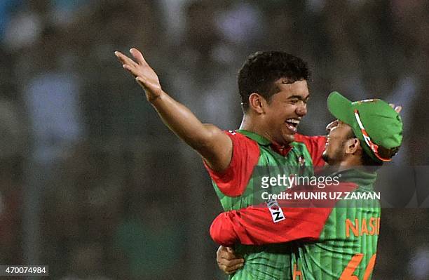 Bangladesh cricketer Taskin Ahmed celebrates with teammate Nasir Hossain after the dsimissal of Pakistan cricketer Haris Sohail during the first One...
