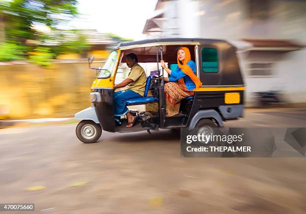 woman riding a tuk tuk taxi - auto rickshaw stock pictures, royalty-free photos & images