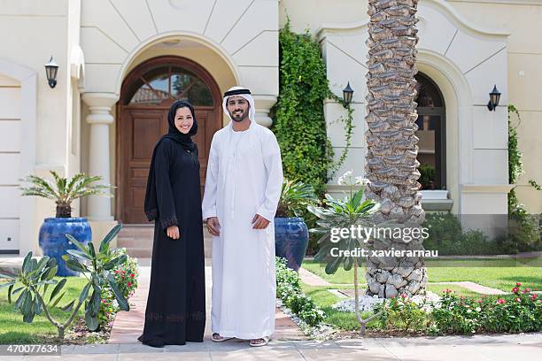arab family portrait in front of their house - standing stock pictures, royalty-free photos & images