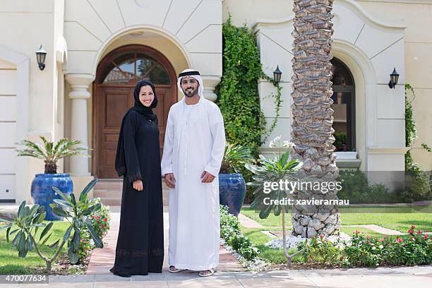 arab family portrait in front of their house - arab family happy stock pictures, royalty-free photos & images