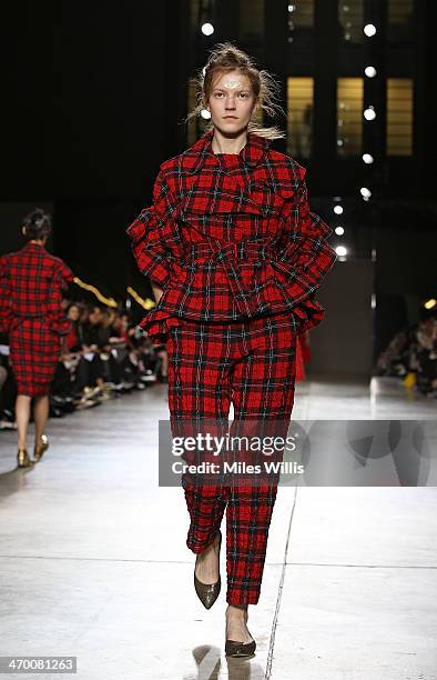 Model walks the runway at the Simone Rocha show at London Fashion Week AW14 at Tate Modern on February 18, 2014 in London, England.