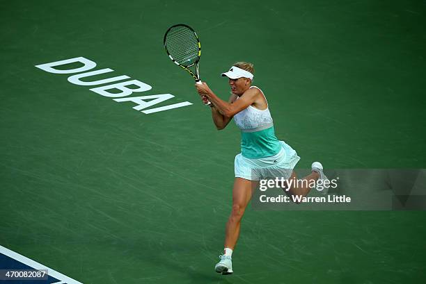 Caroline Wozniacki of Denmark in action against Sabine Lisicki of Germany during day two of the WTA Dubai Duty Free Tennis Championship at the Dubai...