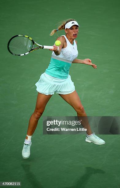 Caroline Wozniacki of Denmark in action against Sabine Lisicki of Germany during day two of the WTA Dubai Duty Free Tennis Championship at the Dubai...