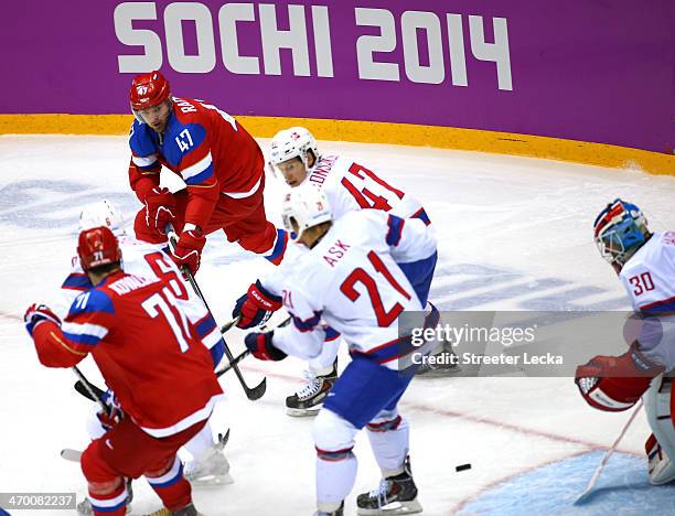 Alexander Radulov of Russia scores a goal in the second period against Lars Haugen of Norway during the Men's Ice Hockey Qualification Playoff game...