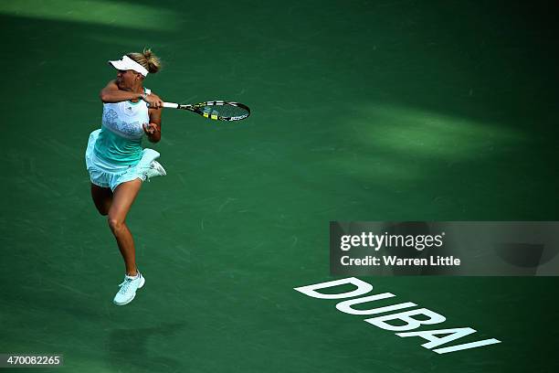 Caroline Wozniacki of Denmark in action against Sabine Lisicki of Germany during day two of the WTA Dubai Duty Free Tennis Championship at the Dubai...