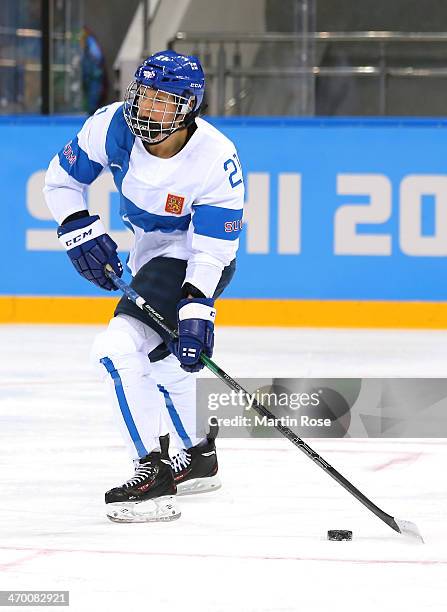 Michelle Karvinen of Finland handles the puck in the second period against Russia during the Women's Classifications Game on day 11 of the Sochi 2014...