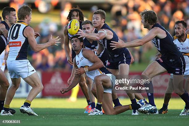 Colin Sylvia of the Dockers and Matt Rosa of the Eagles contest for the ball during the round two NAB Challenge Cup AFL match between the Fremantle...
