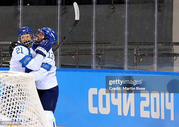 Michelle Karvinen of Finland celebrates with Riikka Valila after her second goal of the third period against Anna Prugova of Russia during the...