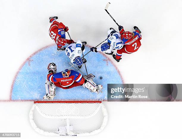 Riikka Valila of Finland shoots against Anna Prugova of Russia in the third period during the Women's Classifications Game on day 11 of the Sochi...