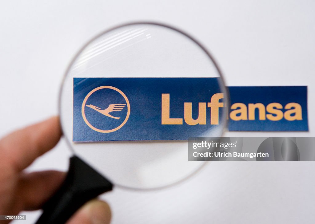 Magnifying glass with logo Lufthansa AG.
