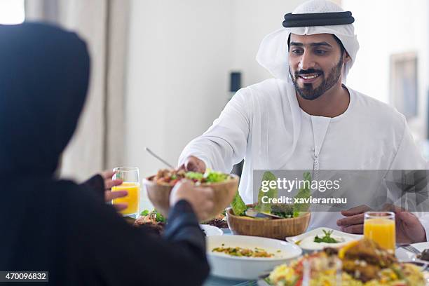having lunch - dubai cares stock pictures, royalty-free photos & images