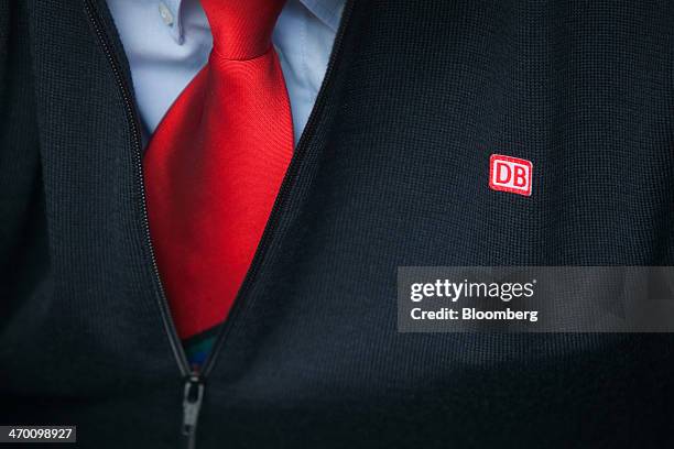 The Deutsche Bahn AG logo sits on a train driver's jacket as a new Siemens AG 407 series InterCity Express 3 Velaro-D train is presented at the...