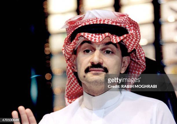 Saudi billionaire Prince al-Walid bin Talal speaks to AFP at his headquarters in Riyadh 01 December 1999. Prince Walid, ranked in the US media as the...