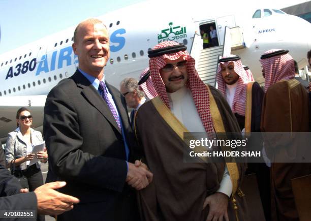 Saudi billionaire Prince Walid bin Talal bin Abdul Aziz al-Saud shakes hands with EADS Chief Executive Officer Tom Enders in front of an Airbus A380...