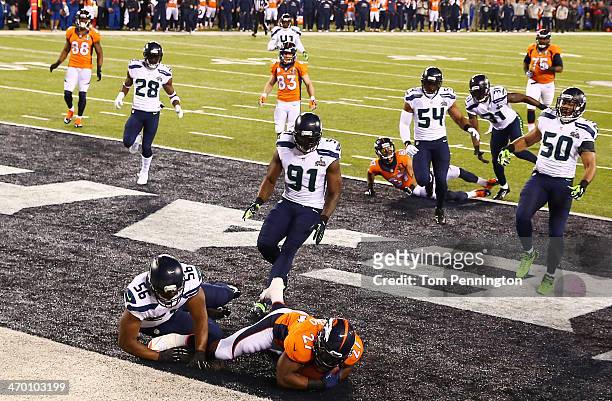 Running back Knowshon Moreno of the Denver Broncos recovers the ball in the endzone for a safety against the Seattle Seahawks during the first...