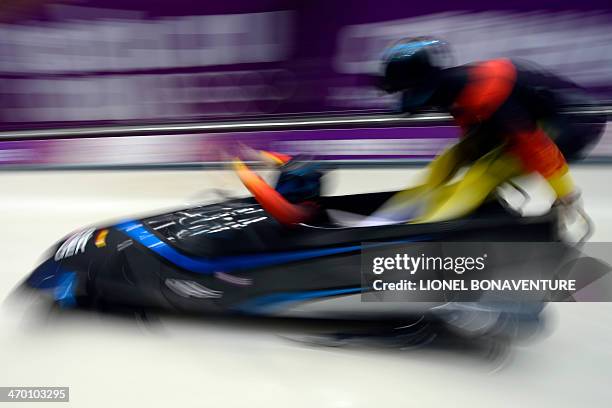 Germany-3 two-woman bobsleigh pilot Anja Schneiderheinze and brakewoman Stephanie Schneider take the start of the Women's Bobsleigh Heat 1 at the...