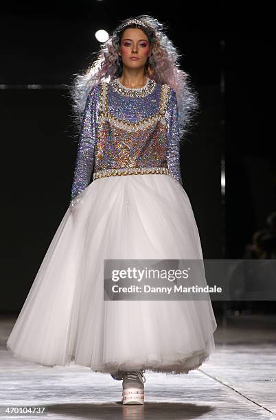 Model walks the runway at the Ashish show at London Fashion Week AW14 at Tate Modern on February 17, 2014 in London, England.