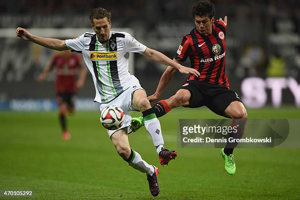 Roel Brouwers of Borussia Moenchengladbach is challenged by Nelson Haedo Valdez of Eintracht Frankfurt during the Bundesliga match between Eintracht...
