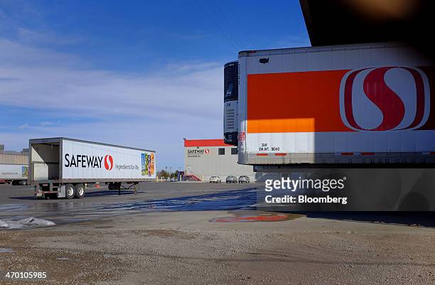 Tractor trailers sit near the Safeway Inc. Frozen food warehouse at the company's distribution center in Denver, Colorado, U.S., on Thursday, Feb....