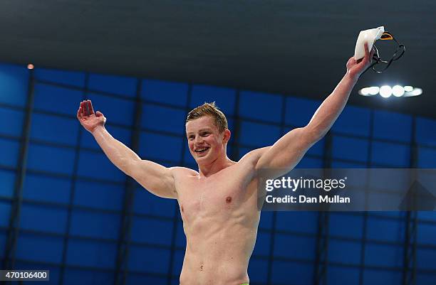 Adam Peaty of Derry celebrates after setting a world record in the Mens Open 100m Breaststroke Final during day four of the British Swimming...