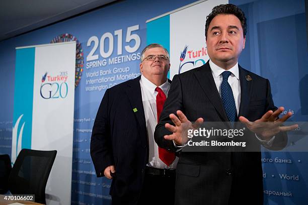 Ali Babacan, Turkey's deputy prime minister, right, speaks to members of the media after a news conference with Agustin Carstens, governor of the...