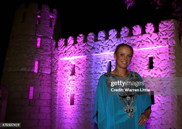 Caroline Wozniacki of Denmark poses for a picture in traditional dress and with a falcon during the players party during day two of the WTA Dubai...