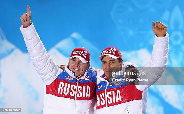 Gold medalists Alexander Zubkov and Alexey Voevoda of Russia team 1 celebrate on the podium during the medal ceremony for the Men's Two-Man Bobsleigh...