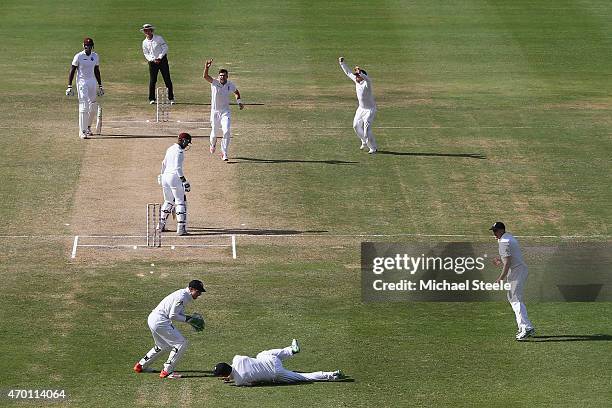 James Anderson of England claims the wicket of Denesh Ramdin of West Indies caught by Alastair Cook at first slip to pass Ian Botham's record of 383...