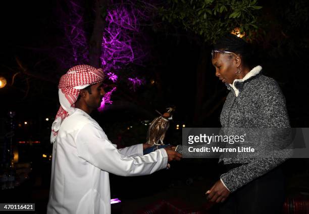 Venus Williams of the USA is shown a falcon during the players party on day two of the WTA Dubai Duty Free Tennis Championship at the Dubai Tennis...