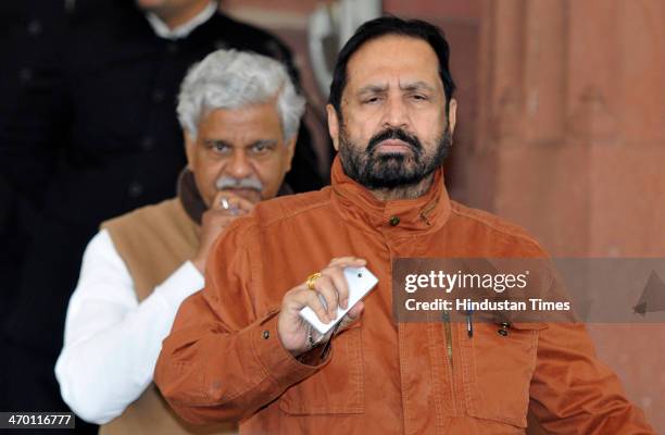 Lok Sabha MP Suresh Kalmadi leaves after attending Parliament session on February 18, 2014 in New Delhi, India. The Lok Sabha passed a contentious...