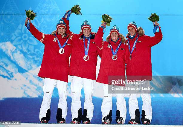 Silver medalists Michael Hayboeck, Thomas Morgenstern, Thomas Diethart and Gregor Schlierenzauer of Austria celebrate during the medal ceremony for...