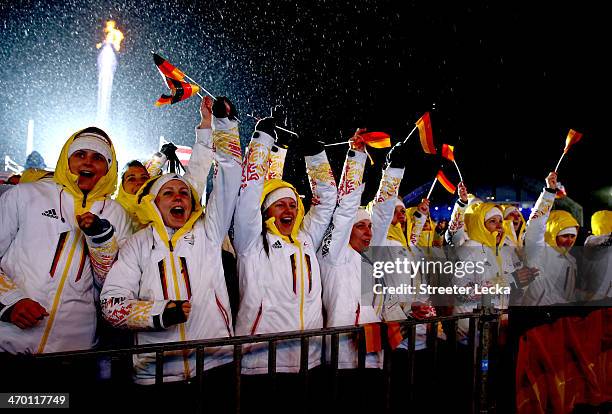 German fans celebrate during the medal ceremony for the Men's Team Ski Jumping on day 11 of the Sochi 2014 Winter Olympics at Medals Plaza on...