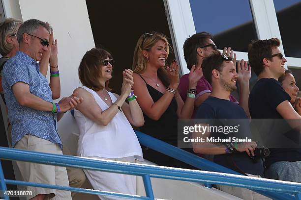 The parents of James Anderson and wife Daniella Anderson applaud after James Anderson of England claims the wicket of West Indies to pass Ian...