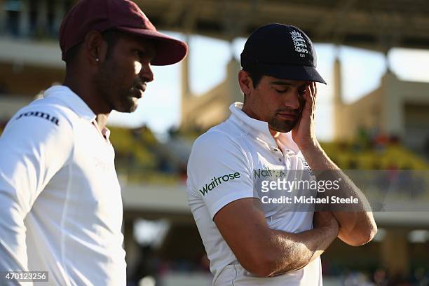 Alastair Cook the captain of England alongside Denesh Ramdin the captain of West Indies at the end of match ceremonies during day five of the 1st...