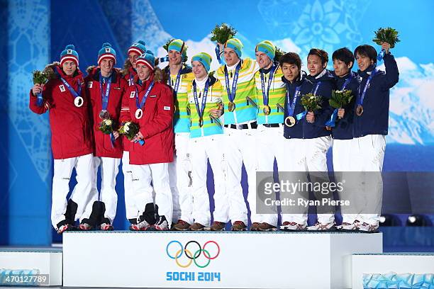 Silver medalists Michael Hayboeck, Thomas Morgenstern, Thomas Diethart and Gregor Schlierenzauer of Austria, gold medalists Wank, Marinus Kraus,...