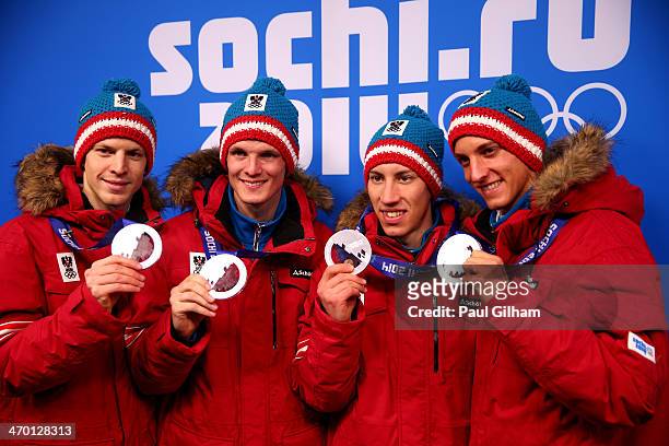 Silver medalists Michael Hayboeck, Thomas Morgenstern, Thomas Diethart and Gregor Schlierenzauer of Austria celebrate during the medal ceremony for...