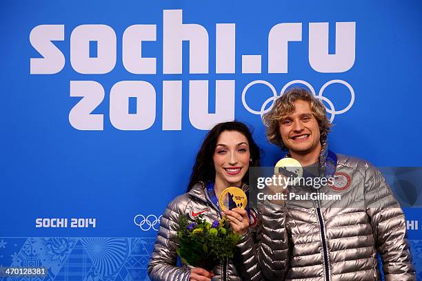 Gold medalists Meryl Davis and Charlie White of the United States celebrate during the medal ceremony for the Figure Skating Ice Danceon day 11 of...