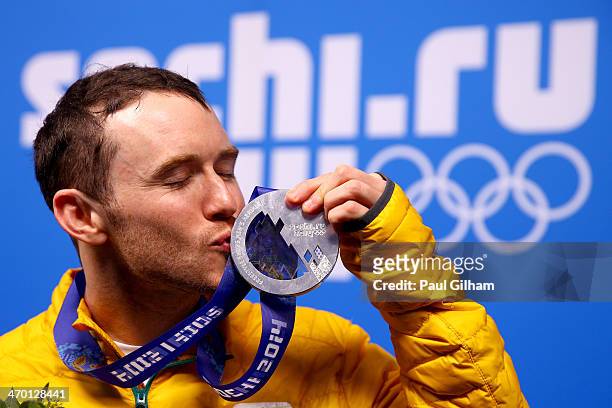 Silver medalist David Morris of Australia celebrates on the podium during the medal ceremony for the Freestyle Skiing Men's Aerials Finals on day 11...