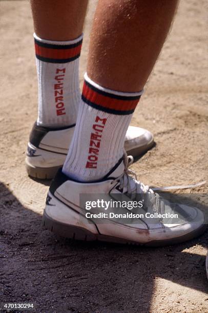 Close up of tennis star John McEnroe and his eponymous socks and Nike tennis shoes during an exhibition match for Cerebral Palsy Research at the Mita...