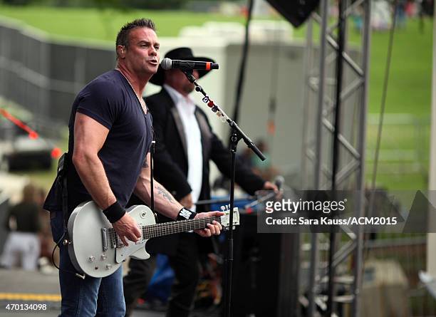 Singer Troy Gentry of Montgomery Gentry perform onstage during the ACM Party For A Cause Festival at Globe Life Park in Arlington on April 17, 2015...