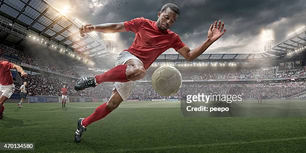 soccer hero in action - black soccer player stock pictures, royalty-free photos & images