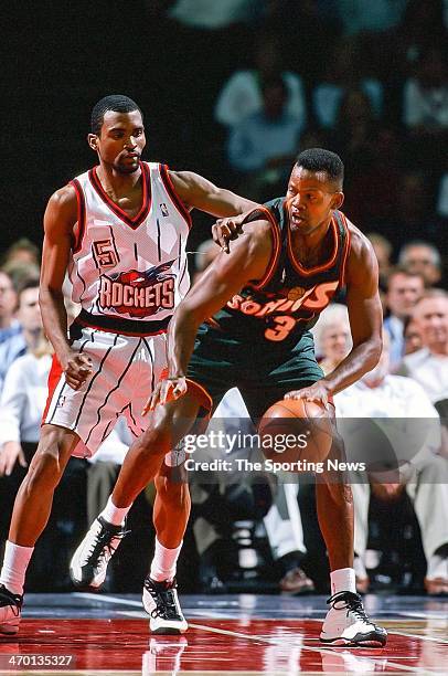 Dale Ellis of the Seattle Supersonics moves the ball against Cuttino Mobley of the Houston Rockets during the game on April 19, 1999 at Compaq Center...