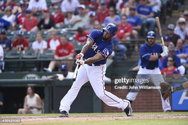 Carlos Peguero of the Texas Rangers bats against the Houston Astros at Globe Life Park in Arlington on April 12, 2015 in Arlington, Texas. The...