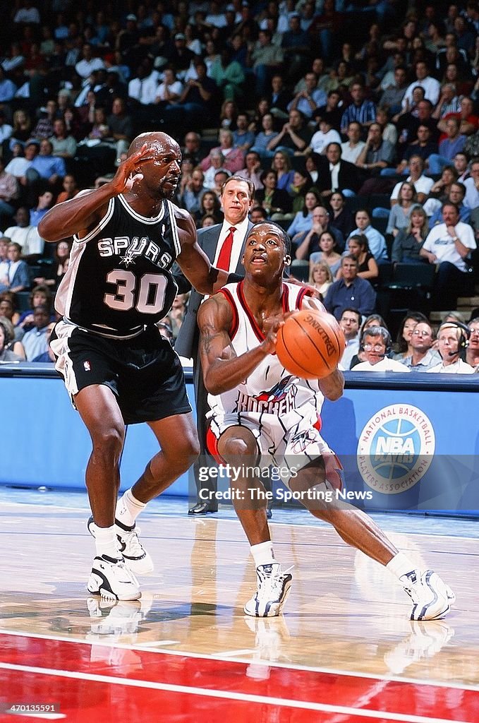 Francis Houston Rockets Steve Francis of the Houston Rockets moves the ball against Terry ...