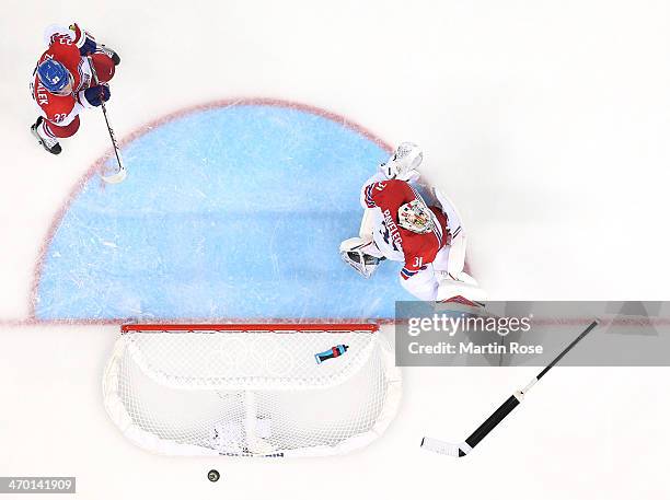 Ondrej Pavelec of Czech Republic loses his stick as a puck flies by in the third period against Slovakia during the Men's Qualification Playoff Game...
