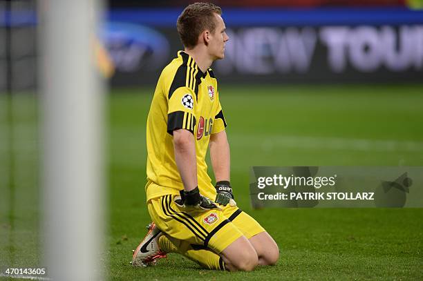 Leverkusen's goalkeeper Bernd Leno reacts after the 0-1 goal during the first-leg round of 16 UEFA Champions League football match Bayer 04...