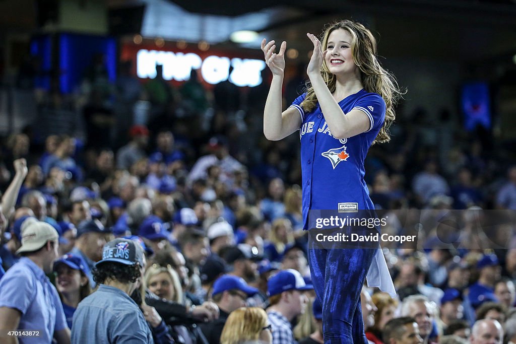 Toronto Blue Jays J-Force member leads the crowd in singing "Take me out to the ballgame.