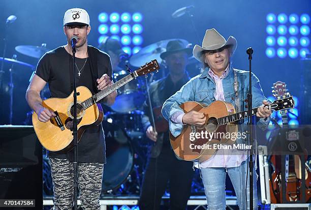 Recording artists Sam Hunt and Dwight Yoakam perform onstage during ACM Presents: Superstar Duets at Globe Life Park in Arlington on April 17, 2015...